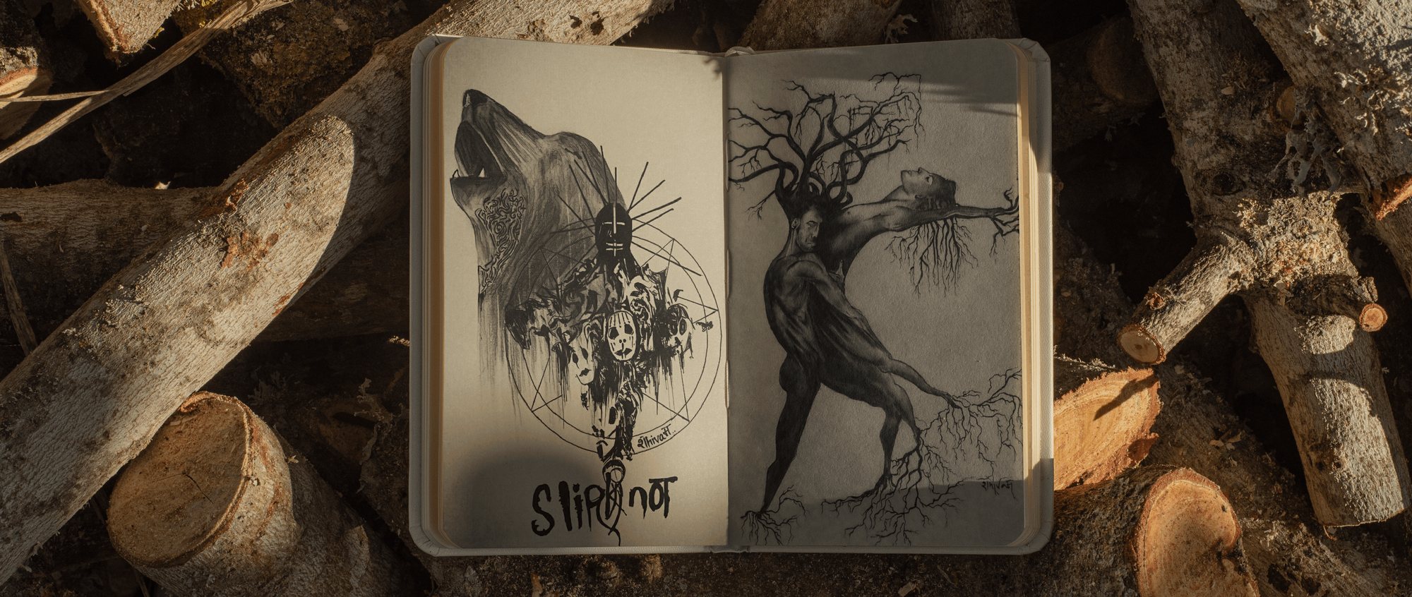Open sketchbook with ink drawings of a figure and a tree-like woman